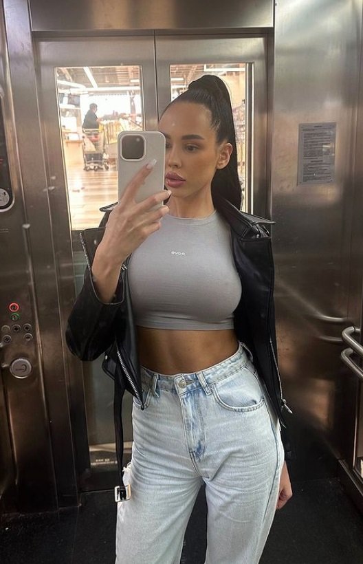 Kristina stylish escort selfie in grey top and ripped jeans