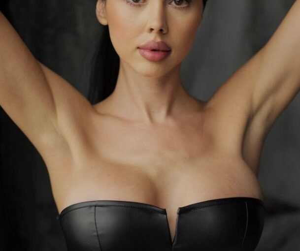 Kristina stunning escort Amsterdam in black leather strapless corset
