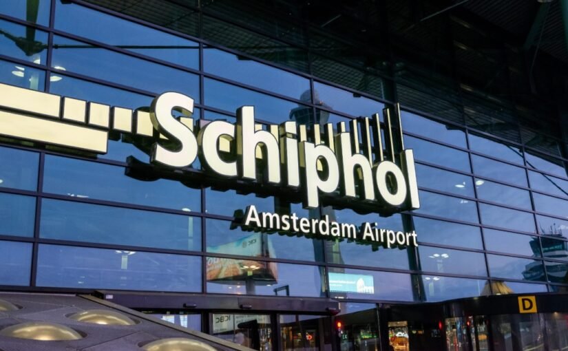 Elegant Amsterdam escort greeting international traveler at Schiphol Airport