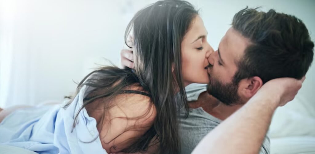 Elegant couple kissing with escort in Amsterdam