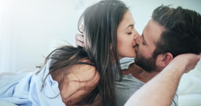 Elegant couple kissing with escort in Amsterdam