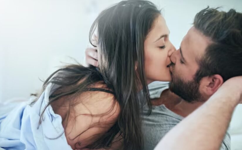 Elegant couple kissing with escort in Amsterdam