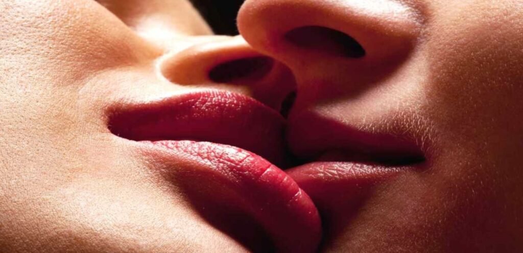 Discreet GFE escort kiss with business traveler French kissing moment in luxury escort suite